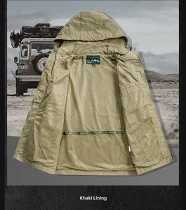 Detail of khaki outdoor jacket showing breathable mesh lining and brand mountain logo