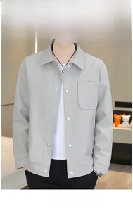 Detail showing light grey men's jacket with fine vertical texture and classic metal buttons