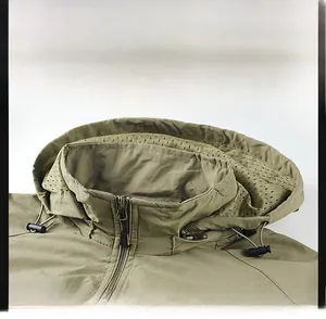 Detail of army green windproof collar with adjustable drawstring and breathable mesh lining