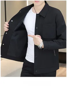 Detail of black corduroy shirt jacket featuring single-breasted buttons and a chest pocket
