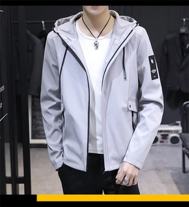 Detail of light grey hooded jacket featuring black TYPHOON drawstring and branded arm patch