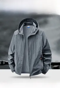 Detail of dark gray sun protection jacket with hood and elastic cuffs for outdoor fishing