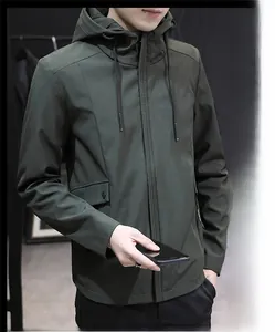 Detail of dark green hooded jacket featuring zipper closure and adjustable drawstring hood