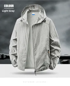 Detailed view of light gray outdoor jacket with ripstop texture and drawstring hood