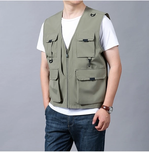 Detail view of olive green tactical fishing vest with functional multi-pockets and D-rings