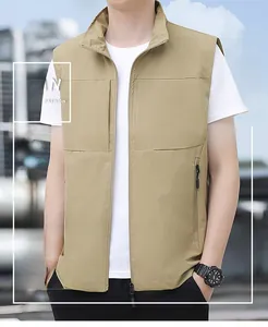 Detail view of khaki outdoor vest showing stand collar and secure zipper chest pocket