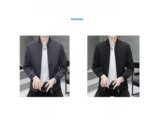 Detail view of slim-fit men's jackets with stand collar in grey and black colors
