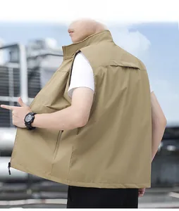 Detail view of khaki tactical vest featuring stand collar and side zip pocket outdoors
