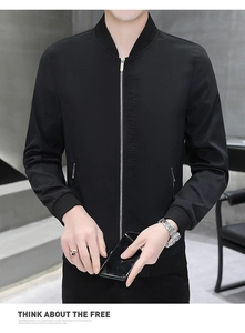 Detail of a men's black jacket featuring a silver zipper and chest embroidery