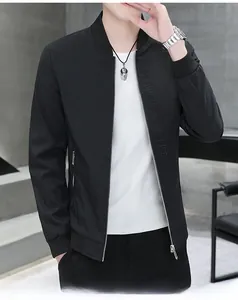 Detail of men's casual black jacket showing 'BE AN ARTIST OF LIFE' embossed lettering