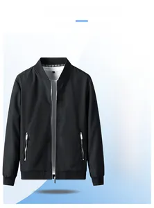 Detail of black men's pilot jacket with stand collar, zip pockets and ribbed cuffs