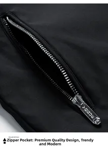 Detailed macro view of a metallic zipper pocket on a black casual jacket with VOGUE engraving