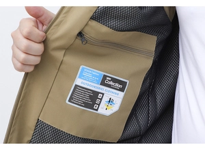Macro view of inner zipper pocket and breathable mesh lining on khaki fishing vest
