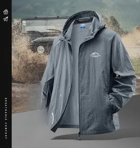Macro detail of breathable dark gray sun protection jacket with outdoor chest logo