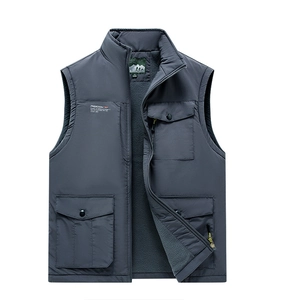 Detailed view of dark blue fleece-lined utility vest with multi-pockets and stand collar
