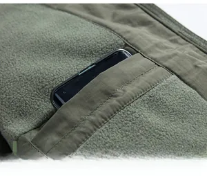 Detail view of inner pocket with warm fleece lining and reinforced stitching on a tactical vest