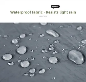 Close-up of waterproof fabric showing water droplets and elastic stretch material