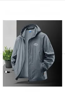 Detail view of dark grey breathable outdoor sun protection jacket with mountain logo
