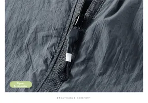 Detail view of water-resistant fabric with textured zipper and pull cord on sun protection jacket