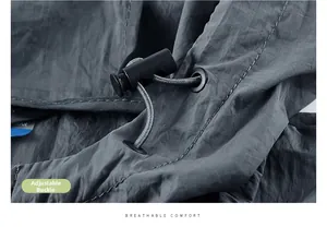 Detail of adjustable elastic cord lock on lightweight breathable sun protection jacket