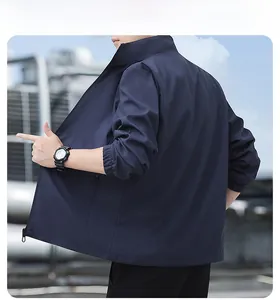 Detailed rear view of dark blue men's stand-collar jacket with elastic ribbed cuffs