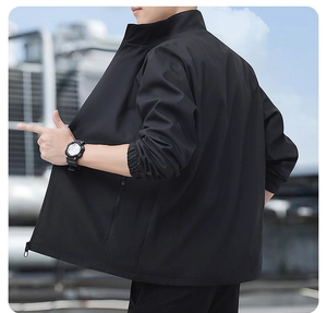 Detail view of the high-quality black stand collar jacket with ribbed cuffs and side pockets