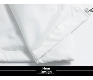 Gros plan détaillé de l'ourlet de la veste blanche avec double couture et fermeture éclair
