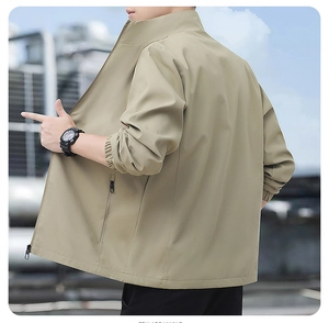 Detail view of khaki casual jacket with stand collar and zipper pocket for men