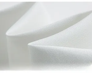 Gros plan sur la texture du tissu blanc tissé d'une veste élégante pour hommes