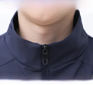 Detail view of navy blue jacket collar with stand-up neckline and smooth zipper puller