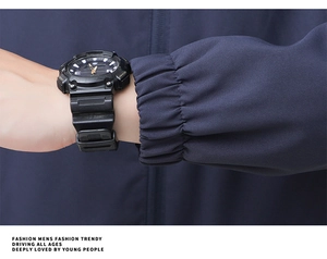 Close-up of black sports watch dial featuring dual digital-analog display on the wrist