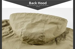 Macro detail of khaki hooded jacket showing windproof fabric and precise flat stitching