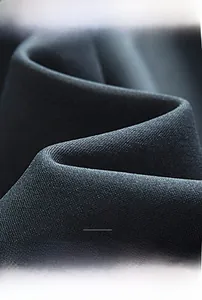 Close-up of charcoal grey high-density fabric showing breathable and elastic texture
