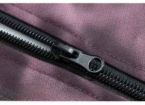 Close-up of premium black zipper and purple textured fabric on men's casual jacket