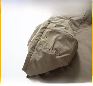 Detail of windproof outdoor jacket featuring a practical detachable hood design