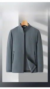 Detail view of water-resistant gray business jacket featuring a classic checkered lining