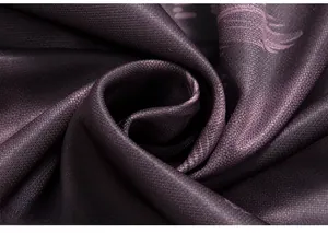 Detailed macro view of purple camo fabric with smooth silk-like texture and soft drape