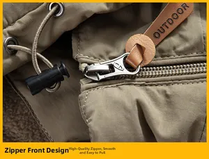 Detailed close-up of zipper placket with leather puller on outdoor hiking jacket