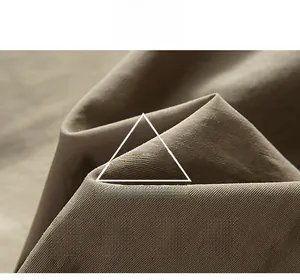 Macro view of waterproof and breathable khaki twill fabric texture for outdoor jackets