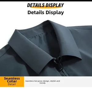 Close-up of seamless heat-pressed collar and matte metal zipper on a blue business jacket