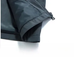 Detailed close-up of the hem stitching and durable zipper on the men's casual jacket