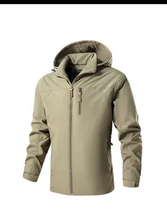 Detail of khaki outdoor jacket showing full-zip, chest pocket, and windproof fabric