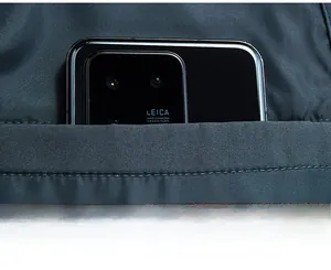 Detailed view of the functional inner pocket on a minimalist men's business jacket