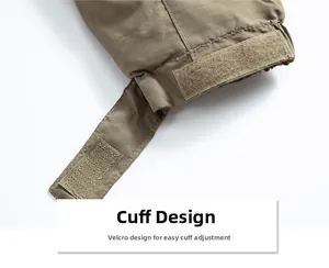 Detail of adjustable Velcro cuff on khaki windproof outdoor tactical jacket sleeve
