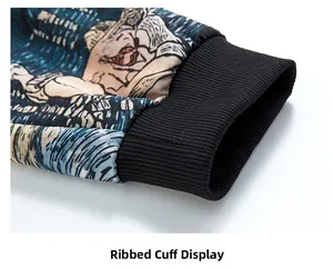 Detail view of the elastic ribbed cuff on a long-sleeved hoodie with vibrant colorful prints