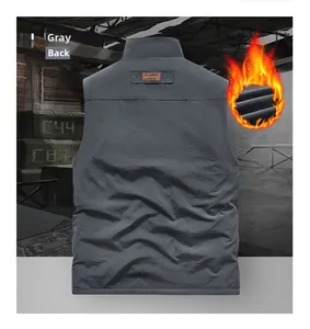 Detail of grey windproof vest featuring warm fleece lining and classic leather neck label