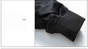 Gros plan d'une veste coupe-vent avec poignets élastiques en maille et coutures soignées