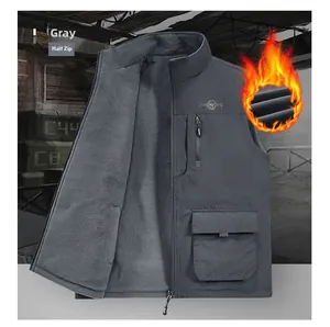 Detail of dark gray fleece lined vest showing thermal material and utility pockets