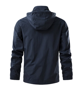 Detail of navy blue windproof jacket back featuring hood and water-resistant fabric texture