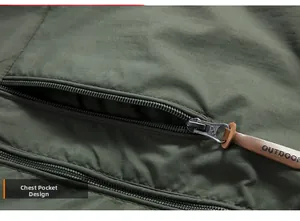 Detail of chest pocket on army green windbreaker with leather outdoor zipper pull